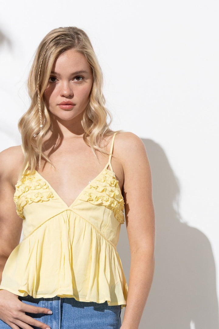Serena Cutout Detail Sleeveless Peplum Top